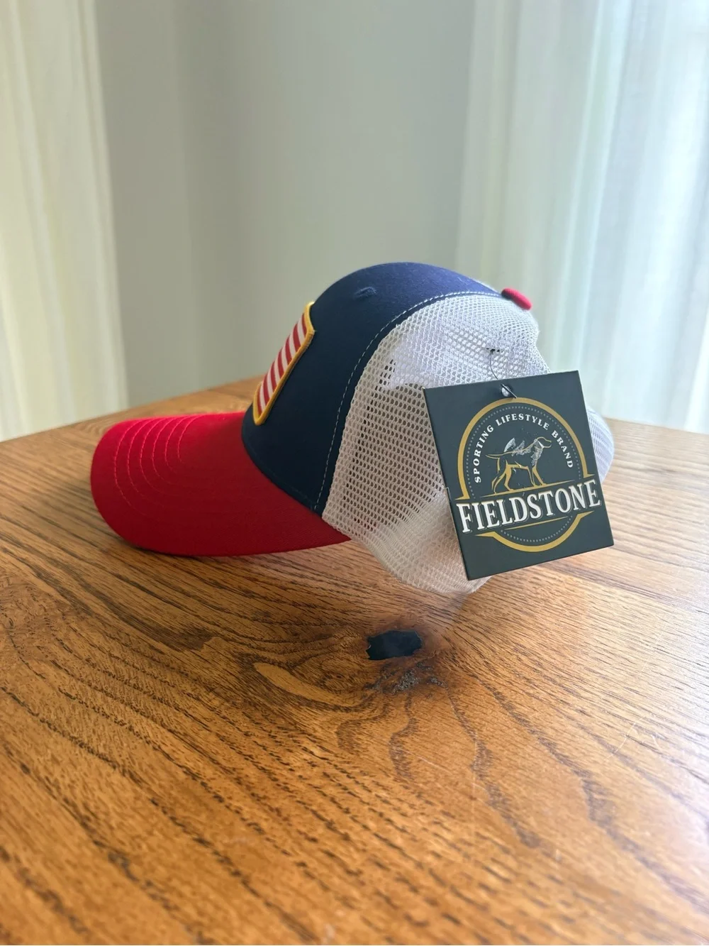 New with tags Fieldstone Mens Red & Navy Trucker Hat with Flag Patch- SnapBack